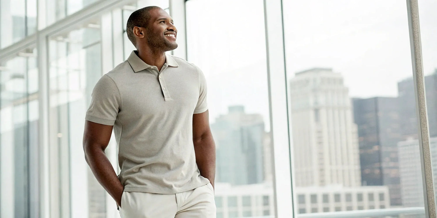 A man wearing a well-fitting light 5XL polo shirt for men.