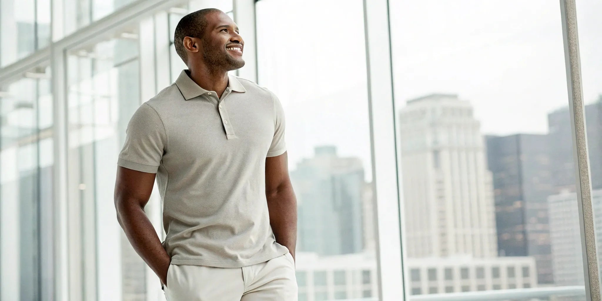 A man wearing a well-fitting light 5XL polo shirt for men.