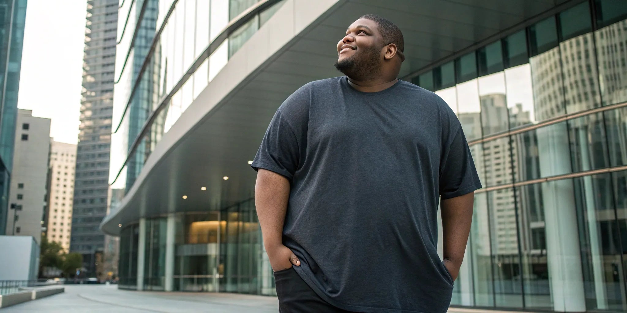 Tall man wearing a great-fitting 3XL t-shirt from a multi-pack.