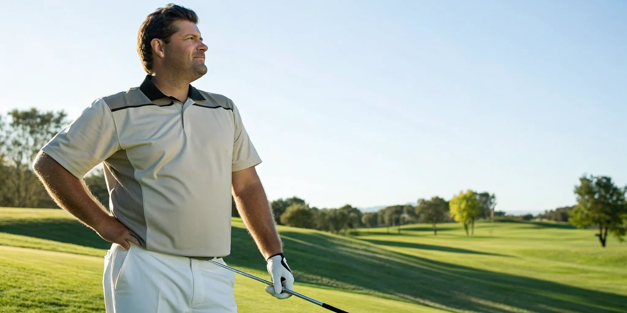 A big man wearing a well-fitting 5XL golf shirt on the golf course.