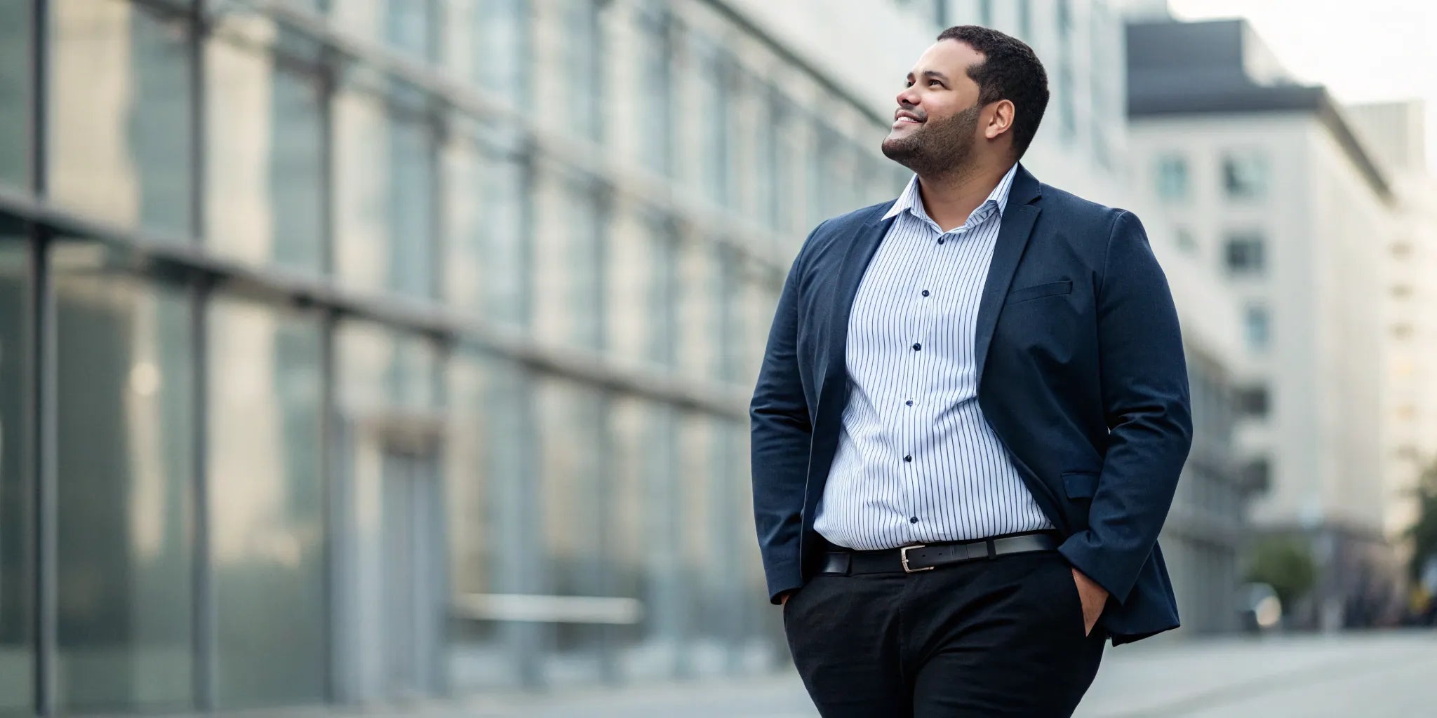 A confident big and tall man in a suit from a men's online outlet.
