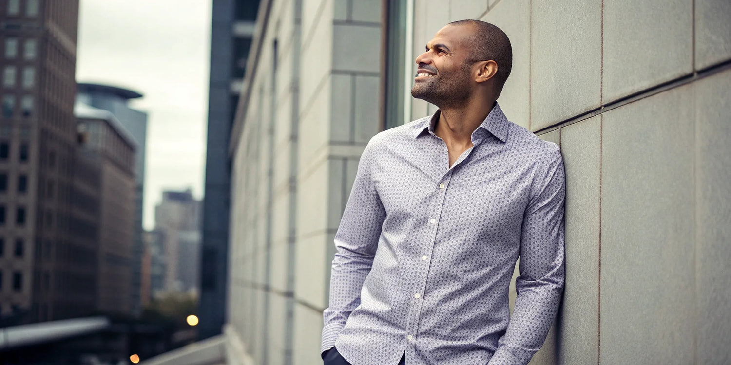 A big and tall man wearing a well-fitting long sleeve button-down shirt.