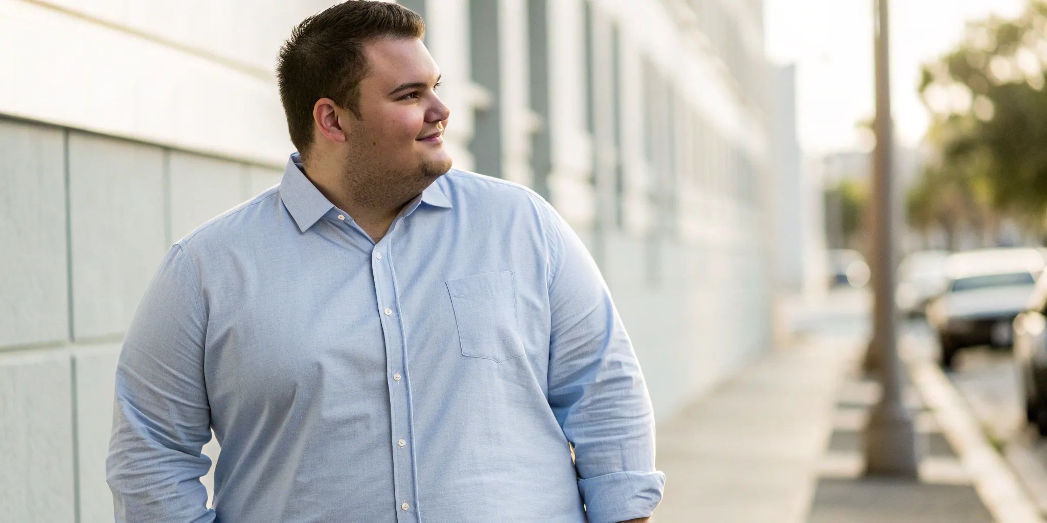 Man in a light blue 6XL mens shirt that fits perfectly.