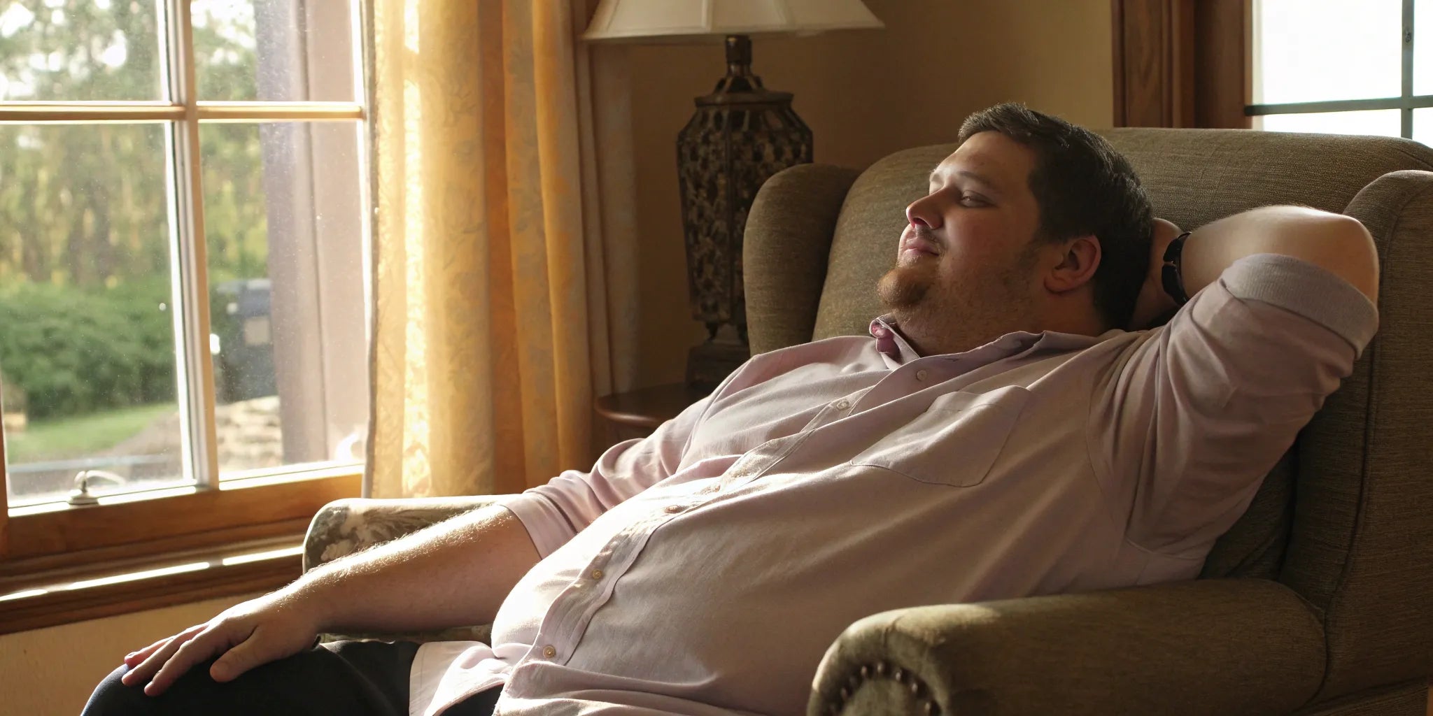 A big guy relaxing in one of the most comfortable shirts designed for a larger frame.