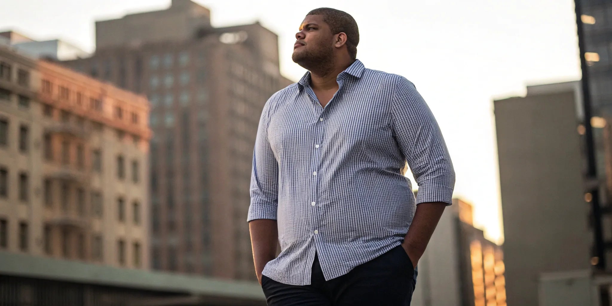 A man in a great-fitting big and tall shirt available on Amazon.