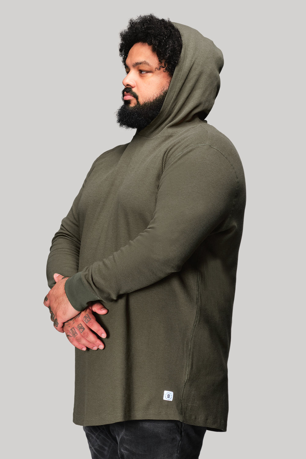 Big and tall man in light grey WaffleFlex thermal hoodie studio photo
