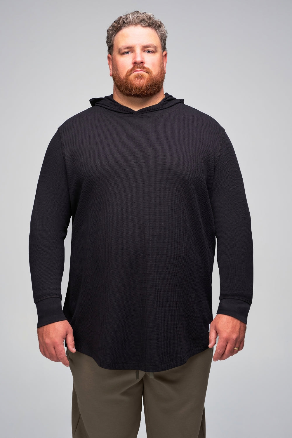 Big and tall man wearing black WaffleFlex thermal hoodie front view