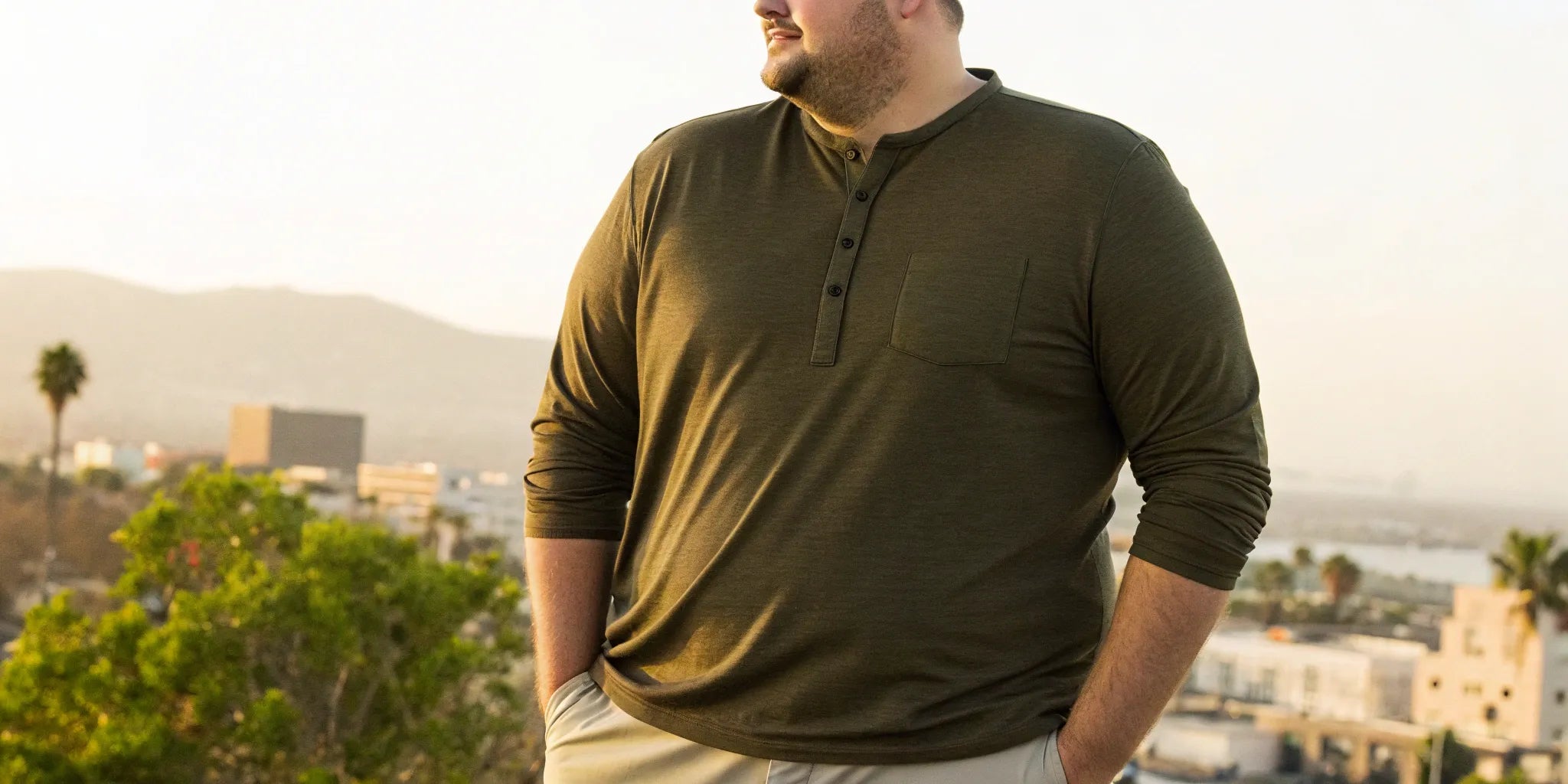 A long-sleeve big and tall mens henley shirt in olive green.